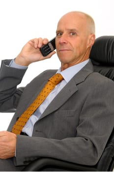 Mature man with cellphone isolated in white