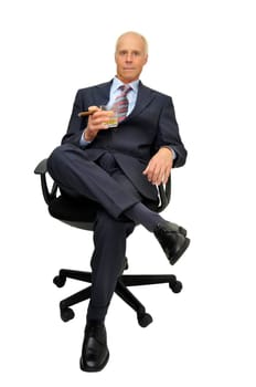Businessman in a chair isolated in white