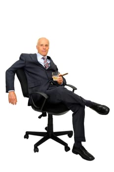 Mature businessman in a chair isolated in white
