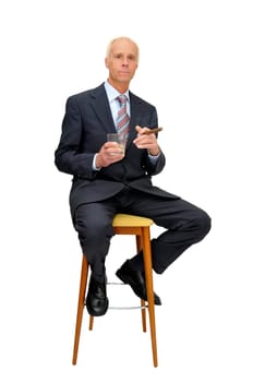 Businessman in a chair isolated in white