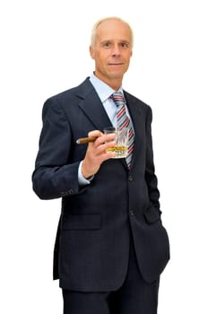 Mature businessman with whisky and cigar isolated in white