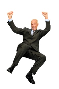 Mature businessman jumping isolated in white