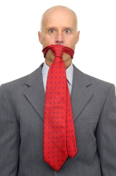 Businessman with tie in is mouth isolated against a white background
