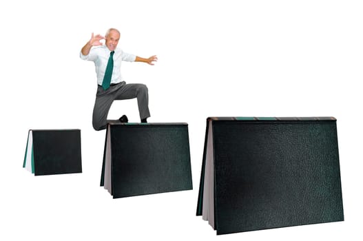 Businessman jumping over books isolated in white