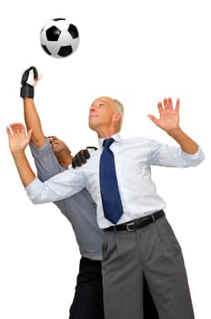 Two businessmen playing soccer isolated in white