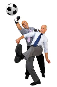 Two businessmen playing soccer isolated in white