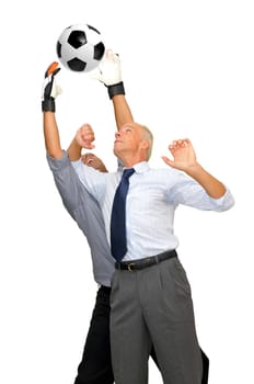 Two businessmen playing soccer isolated in white