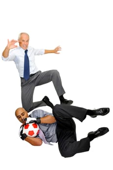 Two businessmen playing soccer isolated in white