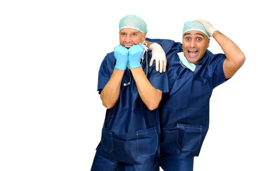 Doctors team in uniform making funny faces isolated in white