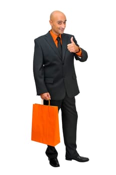 Businessman posing with shopping bags isolated in white
