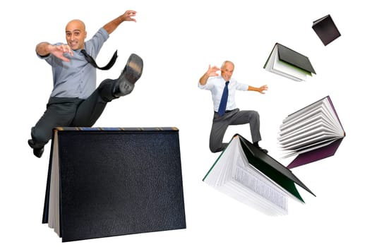 Businessmen jumping over books isolated in white