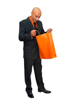 Businessman posing with shopping bags isolated in white