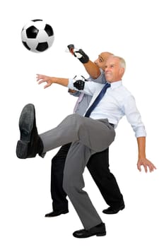 Two businessmen playing soccer isolated in white