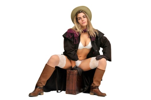 Sexy girl in cowboy outfit isolated in white