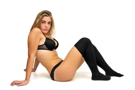Sexy girl in black lingerie isolated in white