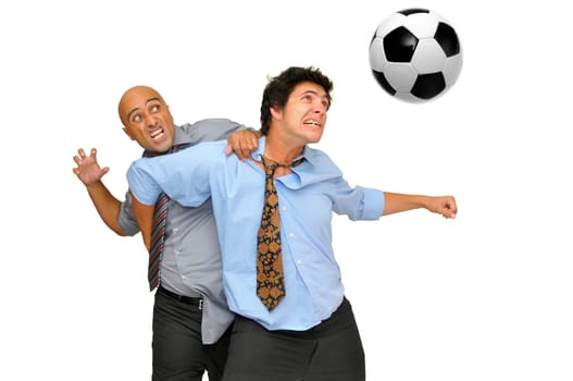 Two businessmen fighting for a soccer ball isolated in white