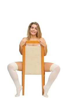 Sexy girl in white lingerie seated in a chair isolated in white