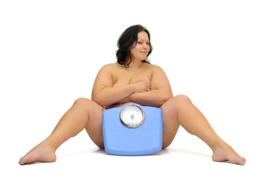 Beautiful nude large girl with weight scale isolated in white