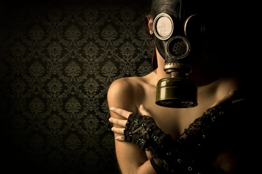 Woman with gas mask in a grunge background