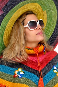 Sexy girl posing with a big sombrero hat isolated in white