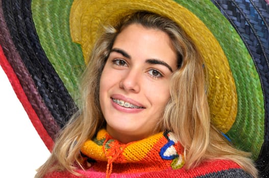 Sexy girl posing with a big sombrero hat isolated in white