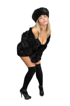 Sexy girl in furs and black lingerie isolated in white