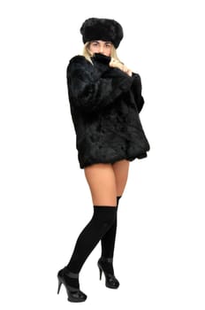Sexy girl in furs and black lingerie isolated in white