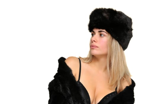 Sexy girl in furs and black lingerie isolated in white