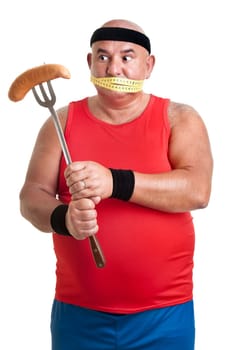 Large fitness man looking at a big sausage isolated in white