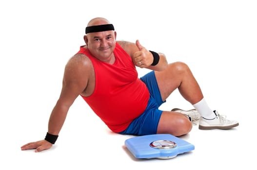 Large fitness man with weight scale isolated in white