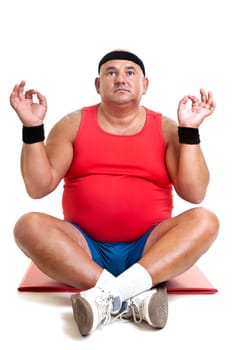 Large fitness man doing yoga exercices isolated in white