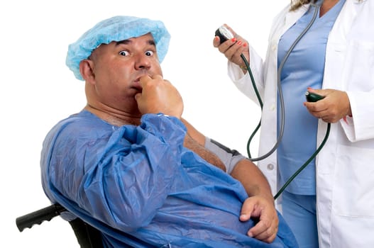 Large male patient in a wheelchair with doctor