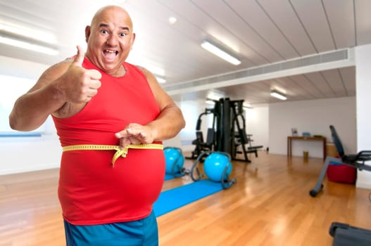Large fitness man with measuring tape
