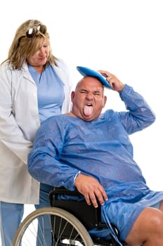 Large male patient in a wheelchair with doctor