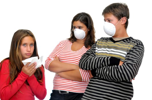 Cildren with masks against flu, and a sick one isolated