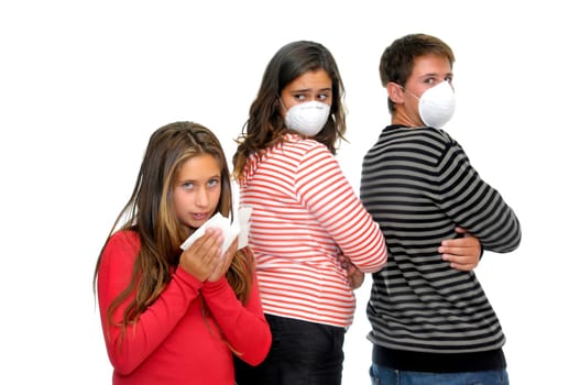 Children with masks against flu, and a sick one isolated
