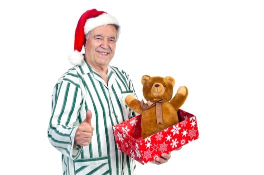 Happy senior with Christmas hat and gift box