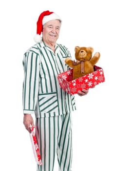Happy senior with Christmas hat and gift box
