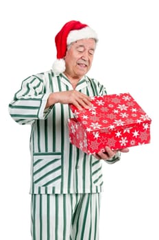 Happy senior with Christmas hat and gift box
