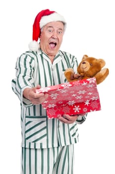 Happy senior with Christmas hat and gift box