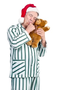 Happy senior with Christmas hat and gift box