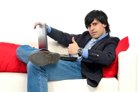 Business man with laptop isolated in white