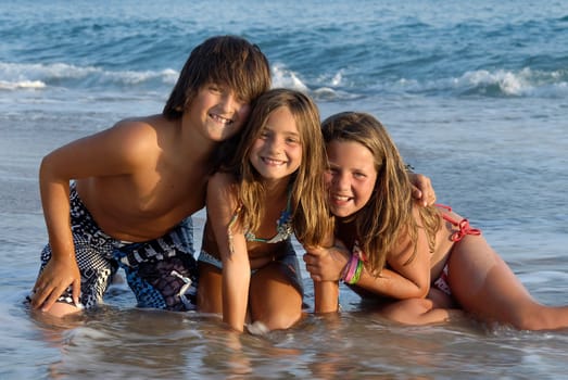 Three brothers posing in the beach