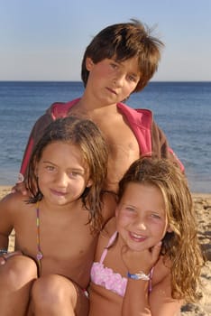 Three brothers in the beach