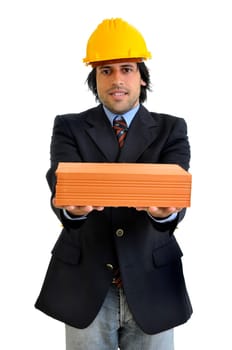 Young engineer with hat and brick isolated in white