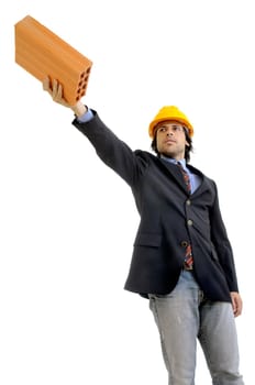 Young engineer with hat and brick isolated in white