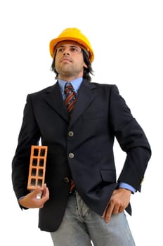 Young engineer with hat and brick isolated in white
