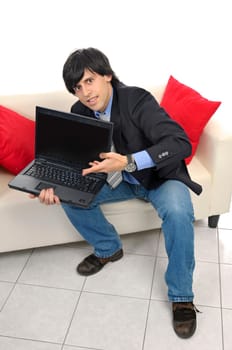 Businessman with laptop isolated in white