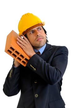 Engineer with a brick isolated in white