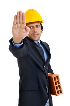 Engineer with a brick isolated in white